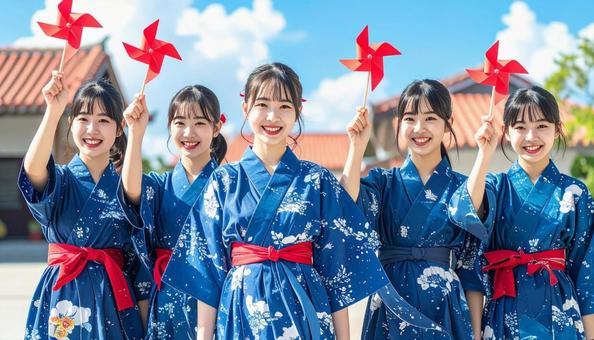 赤い風車を持つ5人の女性 赤い風車を持つ5人の女性の写真