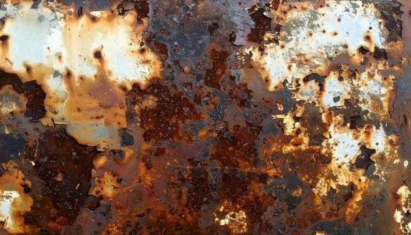 赤くサビてボロボロに朽ちた金属板 赤くサビてボロボロに朽ちた金属板の写真