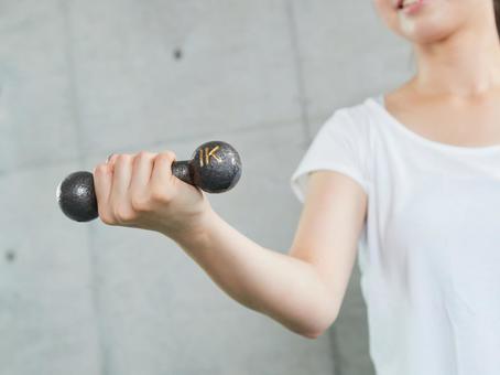 Japanese woman doing dumbbell training at home Japanese woman doing dumbbell training at home