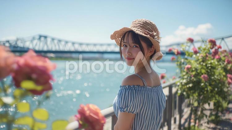 河原でストローハットとワンピースの女性 夏,女性,麦わら帽子の写真素材