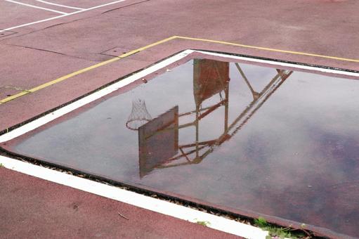 Basketball goal reflected in a puddle, JPG Basketball goal reflected in a puddle, JPG