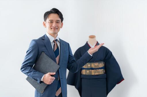 着物を買取するスーツを着た男性 ビジネスマン,男性,スーツの写真素材