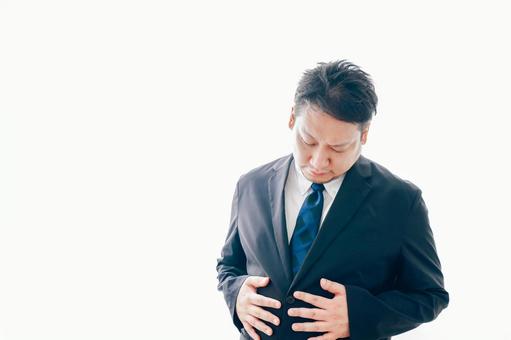 腹痛に苦しむスーツを着た中年男性 腹痛に苦しむスーツを着た中年男性 ビジネスマン,苦しい,痛みの写真素材