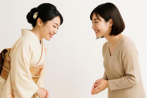 新年の挨拶を交わす女性 新年の挨拶を交わす女性の写真