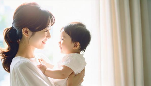 見つめ合う母親と赤ちゃん 見つめ合う母親と赤ちゃんの写真