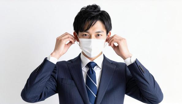 マスクをつける人 マスクをつける人の写真