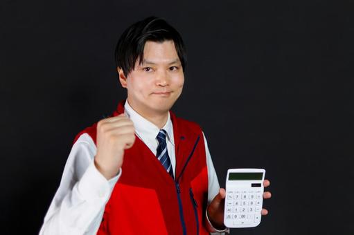 計算機を持つ男性 計算機を持つ男性 男性,計算機,ガッツポーズの写真素材