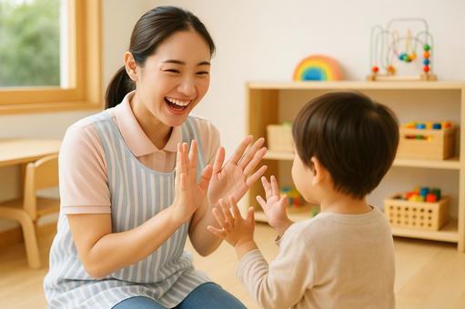 保育士と子どもの手遊び風景 保育士と子どもの手遊び風景の写真