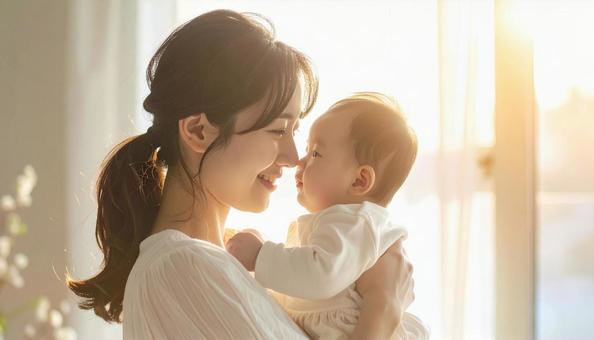 見つめ合う母親と赤ちゃん 見つめ合う母親と赤ちゃんの写真