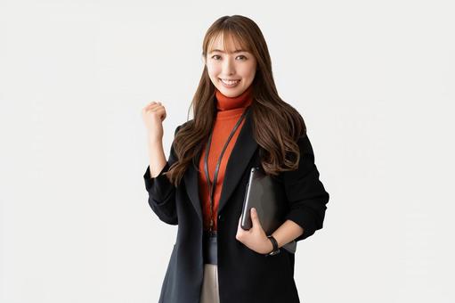ガッツポーズをする女性・ビジネスウーマン ガッツポーズをする女性・ビジネスウーマン 女性,ガッツポーズ,笑顔の写真素材