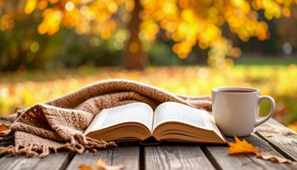 秋の公園読書 本・コーヒー・ブランケット 秋の公園読書 本・コーヒー・ブランケットの写真