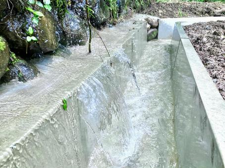 Mountain spring water flowing into an irrigation channel, JPG Mountain spring water flowing into an irrigation channel, JPG