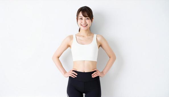 スポーツウェア姿で笑顔女性のポートレート スポーツウェア姿で笑顔女性のポートレートの写真