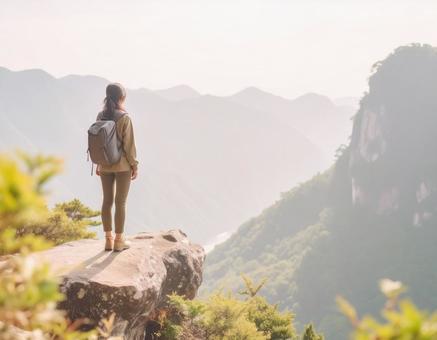 崖の女性と絶景 崖の女性と絶景の写真