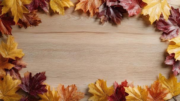 暖かい木目の上に置かれた紅葉 暖かい木目の上に置かれた紅葉の写真