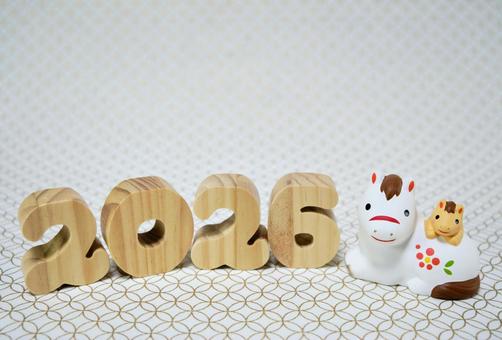 可愛い馬の置物と七宝柄の背景の年賀状素材 年賀状,年賀,背景素材の写真素材