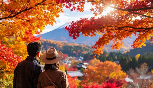 美しい紅葉を眺める夫婦の後ろ姿 美しい紅葉を眺める夫婦の後ろ姿の写真