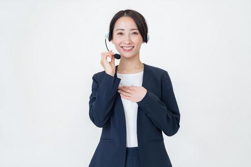 ヘッドセットをつける女性 ヘッドセットをつける女性 オペレーター,ビジネス,ヘッドセットの写真素材