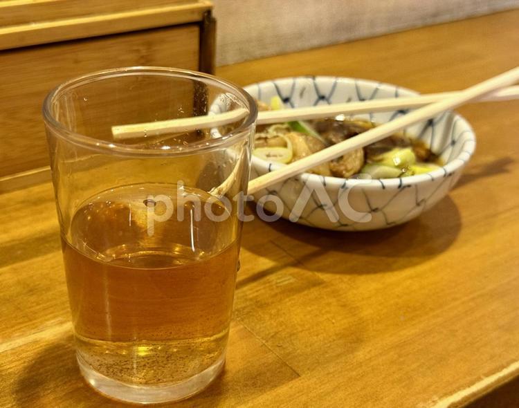 牛筋煮込み　食べかけ こんにゃく,割り箸,コップの写真素材