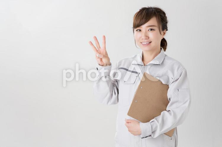 作業服を着たビジネスウーマン 作業着,女性,笑顔の写真素材