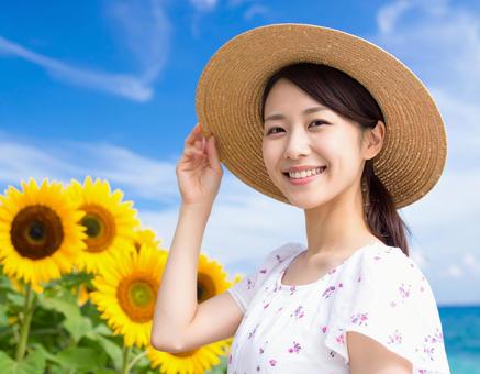ひまわり・麦わら帽子の彼女の写真