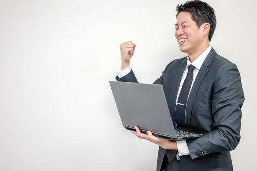 ガッツポーズするビジネスマン ガッツポーズするビジネスマン ビジネスマン,スーツ,ネクタイの写真素材