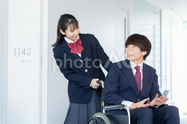 車椅子の高校生と女子高生 教育,塾,勉強の写真素材