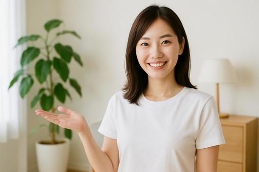 案内ジェスチャーの女性 案内ジェスチャーの女性の写真