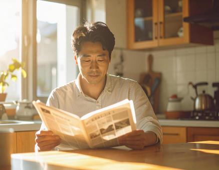 Man reading a newspaper in the morning light, news, japanese men, morning, JPG