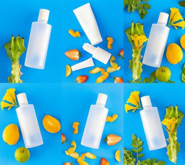 いろいろな白い化粧品のボトルのモックアップと果物や植物(青背景) いろいろな白い化粧品のボトルのモックアップと果物や植物(青背景) モックアップ,物撮り,化粧品の写真素材