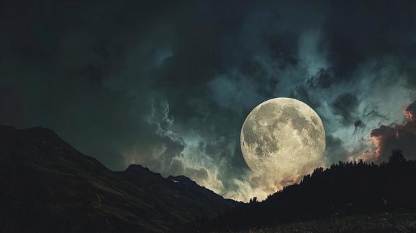 神秘的な光を放つ月と星空の写真