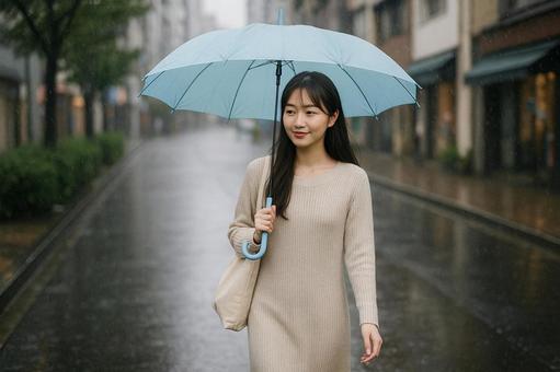 雨の日ニットワンピ女性散歩 雨の日ニットワンピ女性散歩の写真