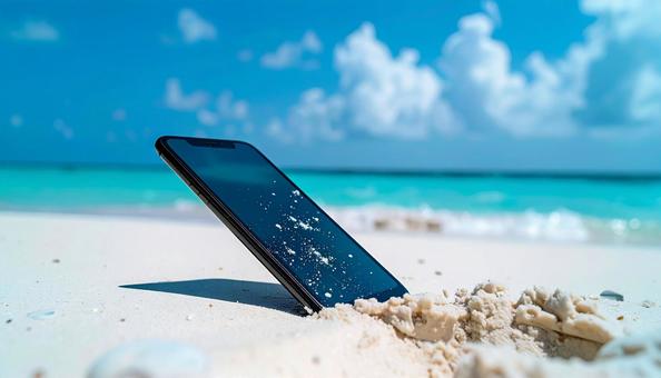 砂浜に刺さったスマートフォン 砂浜に刺さったスマートフォンの写真