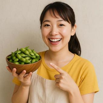 A woman holding edamame beans points to them while introducing them, female, edamame, a smile, JPG