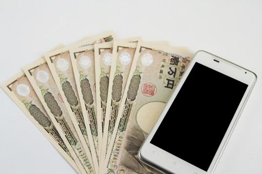 お金とスマートフォン お金とスマートフォン お金,日本円,紙幣の写真素材