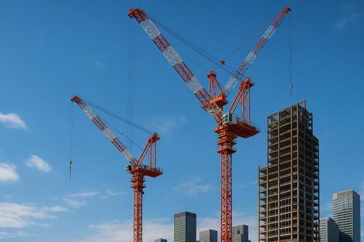 高層ビルを建設中のクレーンの写真