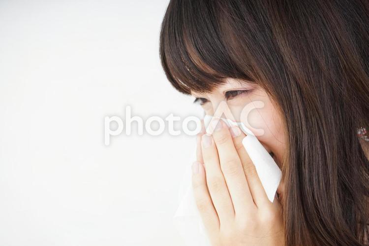 Young woman blowing her nose, JPG Young woman blowing her nose, pollen, hay fever, dust, JPG