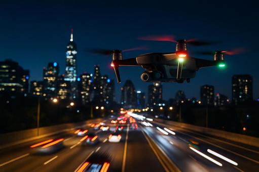 ドローン空撮走行車列追跡撮影 都市夜景 ドローン空撮走行車列追跡撮影 都市夜景の写真