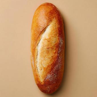 完璧な形をした、焼きたての長いミルクパン 完璧な形をした、焼きたての長いミルクパンの写真