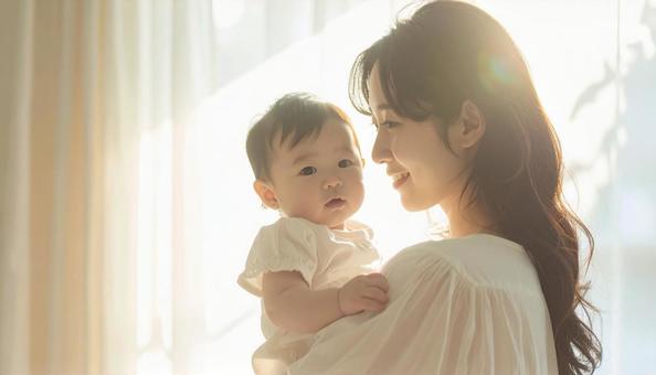 見つめ合う母親と赤ちゃん 見つめ合う母親と赤ちゃんの写真