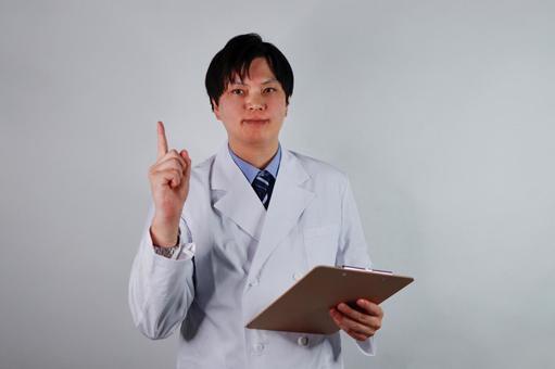 指示する白衣の男性医師 指示する白衣の男性医師 医師,白衣,男性の写真素材