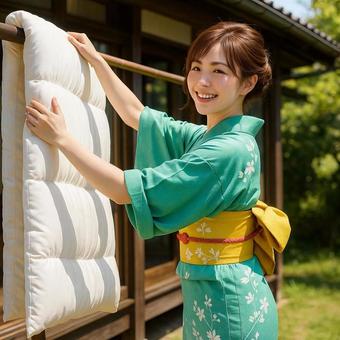 布団を干す和服美人の写真
