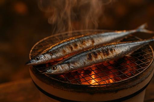 七輪で焼く秋刀魚の写真