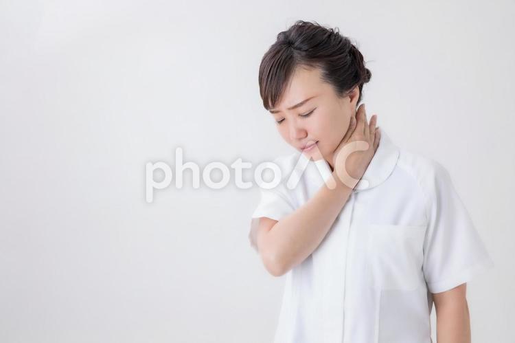 首が痛い白衣の女性 首,痛い,看護師の写真素材