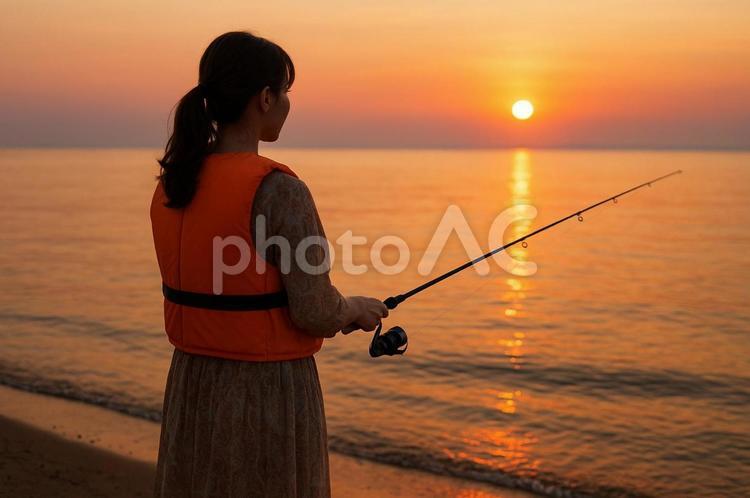 ライフジャケットを着て釣りをする女性 女性,女子,釣りの写真素材