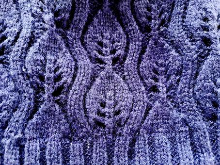 青い毛糸の編み目 青い毛糸の編み目の写真