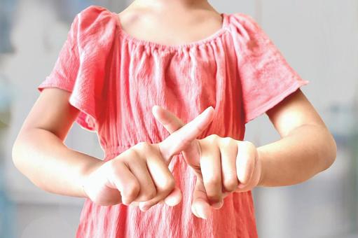 手でバツを作る子供 子ども,子育て,ダメの写真素材