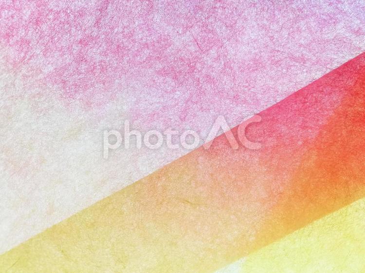 和紙　ピンクに重ねた赤と黄グラデーション 和紙,紙,背景の写真素材