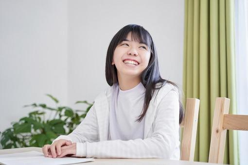 Japanese female junior high school student turning around with a smile in the living room, студент средней школы, женщина, японский, JPG