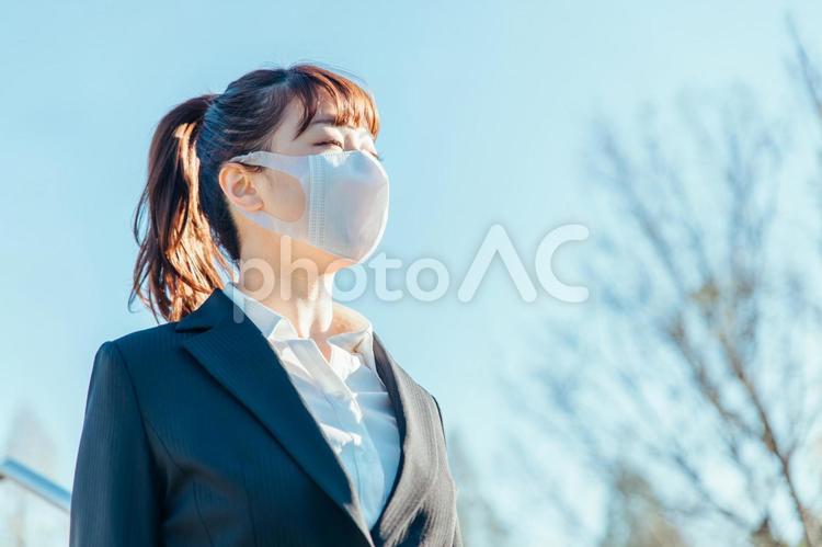 コロナ禍のビジネスウーマン ビジネス,マスク,コロナ禍の写真素材